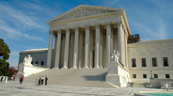 Front of the white marble US Supreme Court building,