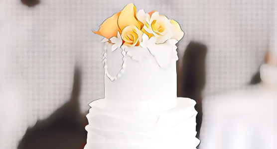 Photo illustration of a white wedding cake with yellow flowers on top